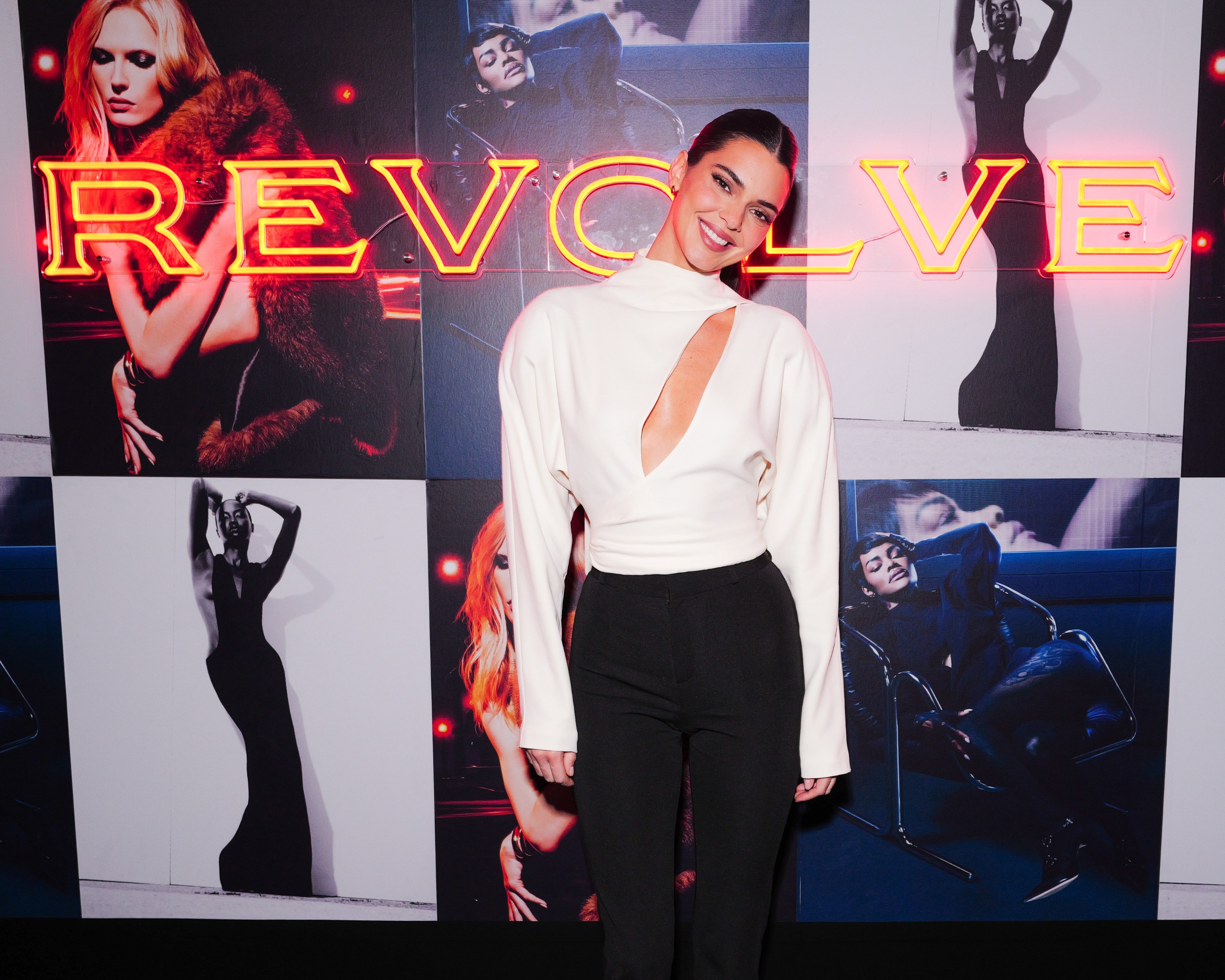 Kendall Jenner attended a Revolve event at Paris Fashion Week in a cut-out turtleneck and black trousers