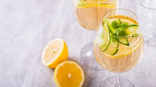 Elderflower spritz cocktail with cucumber garnish