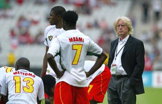 Cameroon coach Winfried Schafer with his players ahead of a Confederations Cup match against Turkey in 2003.