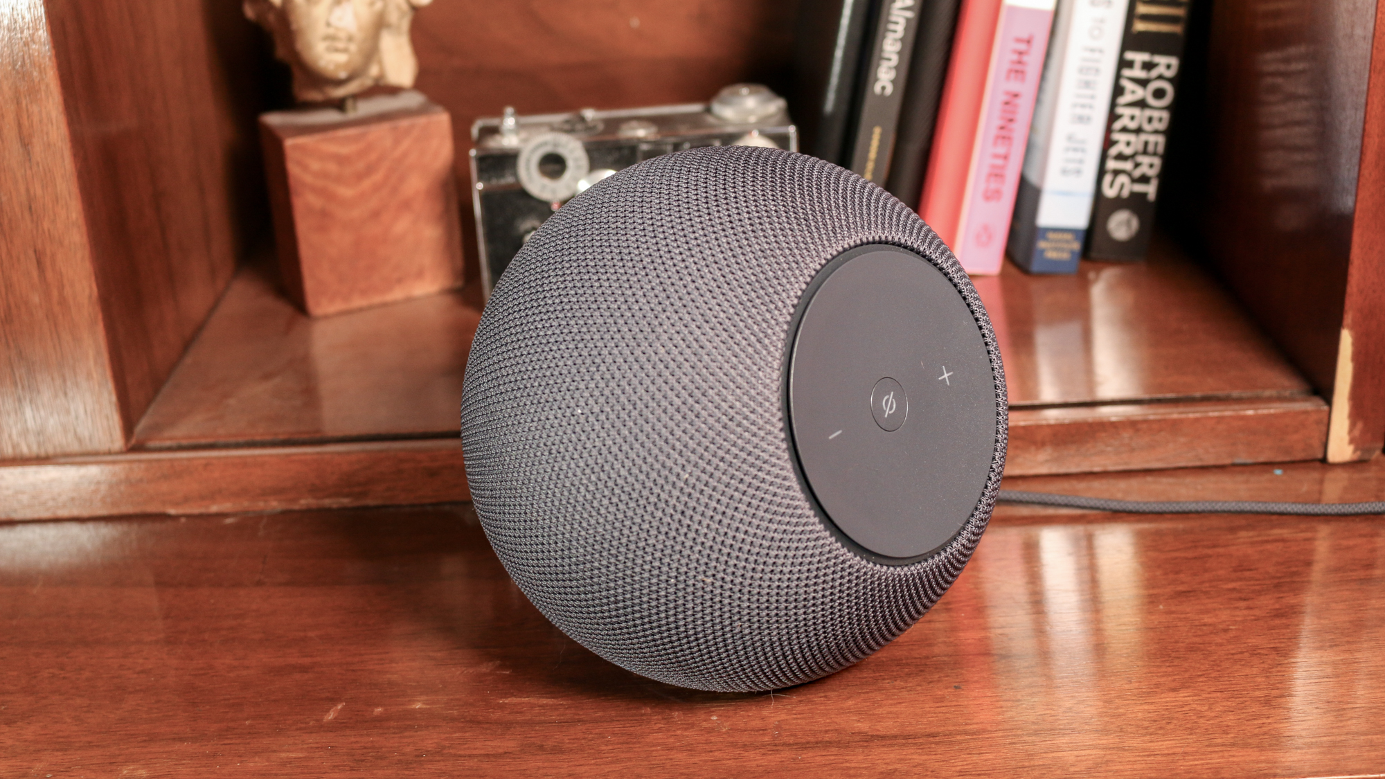 Amazon Echo Studio on a book shelf