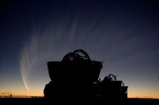 The sweeping image showcases Comet McNaught after sunset, with two Auxiliary Telescopes of the VLTI in the foreground.