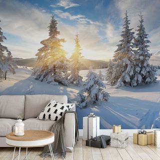morning panorama of mountain in winter wallpaper in living room with grey sofa and gifts on floor