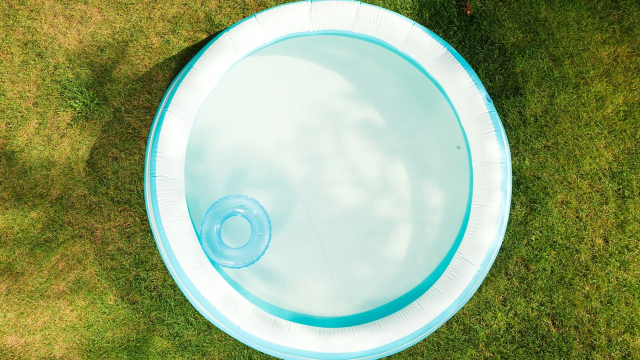 Blue kiddie pool on grass