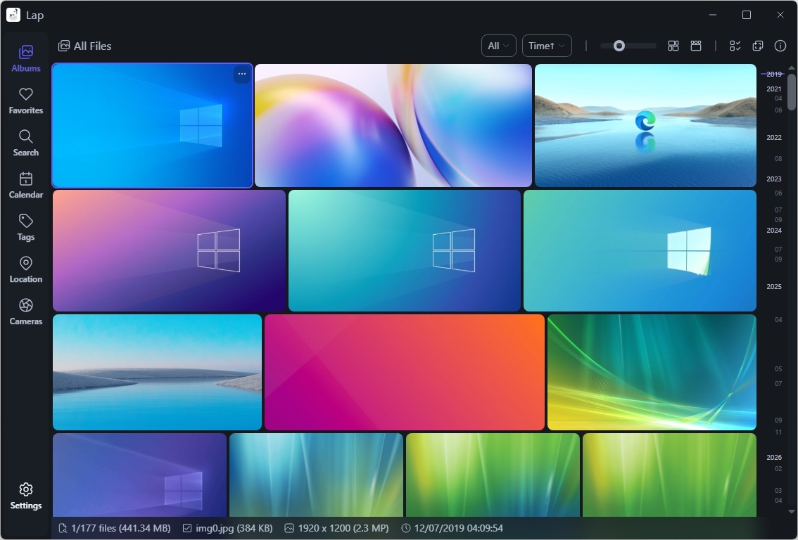 A computer screen displays a grid of colorful wallpapers, including abstract designs and nature themes. A sidebar has file organization options.