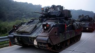POCHEON, SOUTH KOREA - SEPTEMBER 19: U.S. soldiers on M2 Bradley armored vehicles take part during the Warrior Strike VIII exercise at the Rodriguez Range on September 19, 2017 in Pocheon, South Korea. The United States 2ID (2nd Infantry Division) stationed in South Korea operates the exercise to improve defense capability from any invasion. (Photo by Chung Sung-Jun/Getty Images)