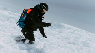 Skier using Mammut Barryvox avalanche beacon