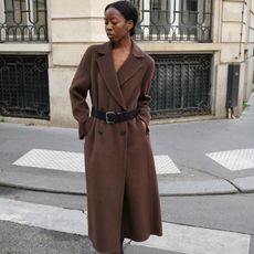 Fashion influencer @sylviemus_ wearing an elegant, on-trend outfit that taps into the "quiet luxury" aesthetic.