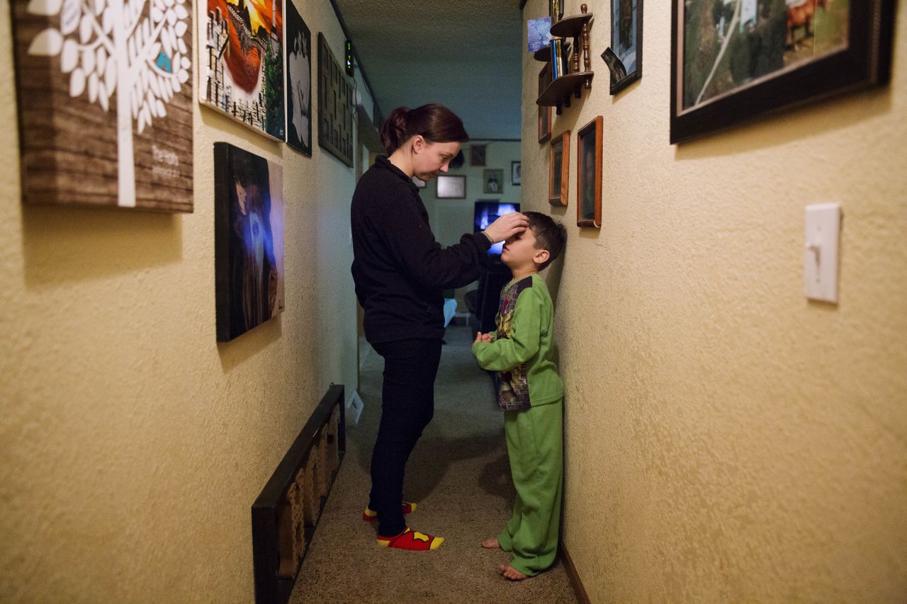 Lydia Holt, left, talks her stepson, Carter, 7, in Wauzeka, Wisconsin on Jan. 17, 2017.