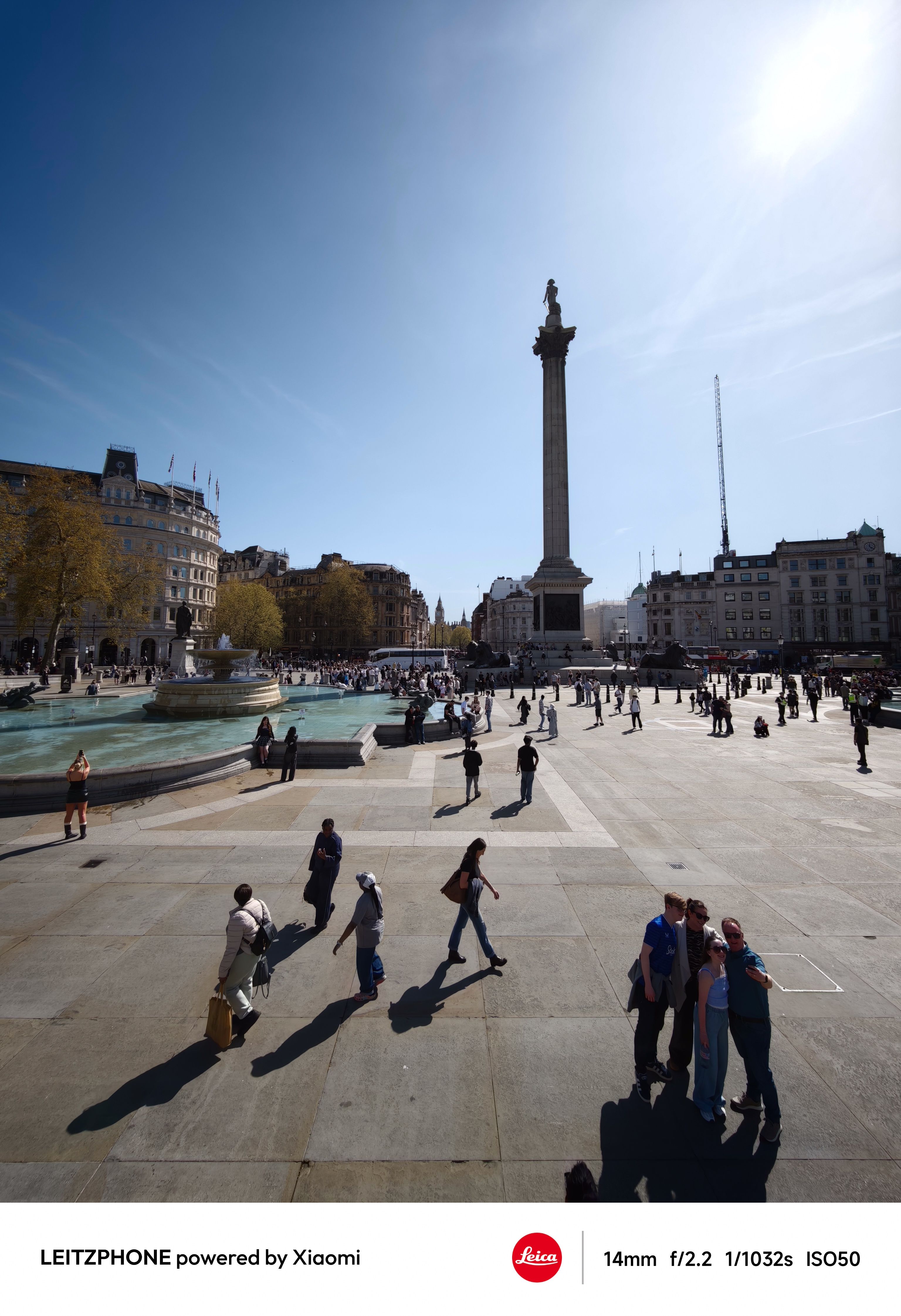 Wide view of Trafalgar Square on a sunny day