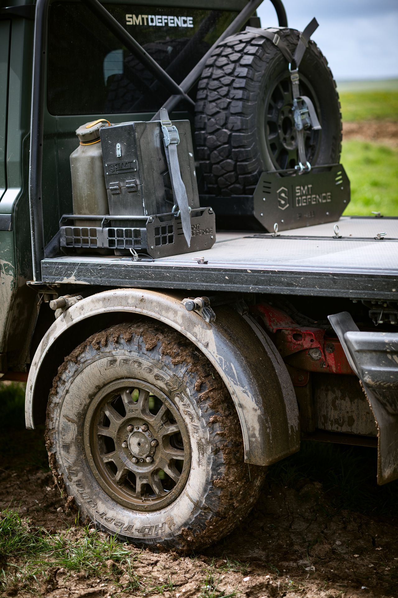 Image of the Ineos Grenadier looking exceptionally muddy. It's a flat-bed style pickup
