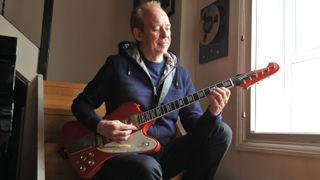 Phil Manzanera poses with his 1964 Gibson Firebird VII