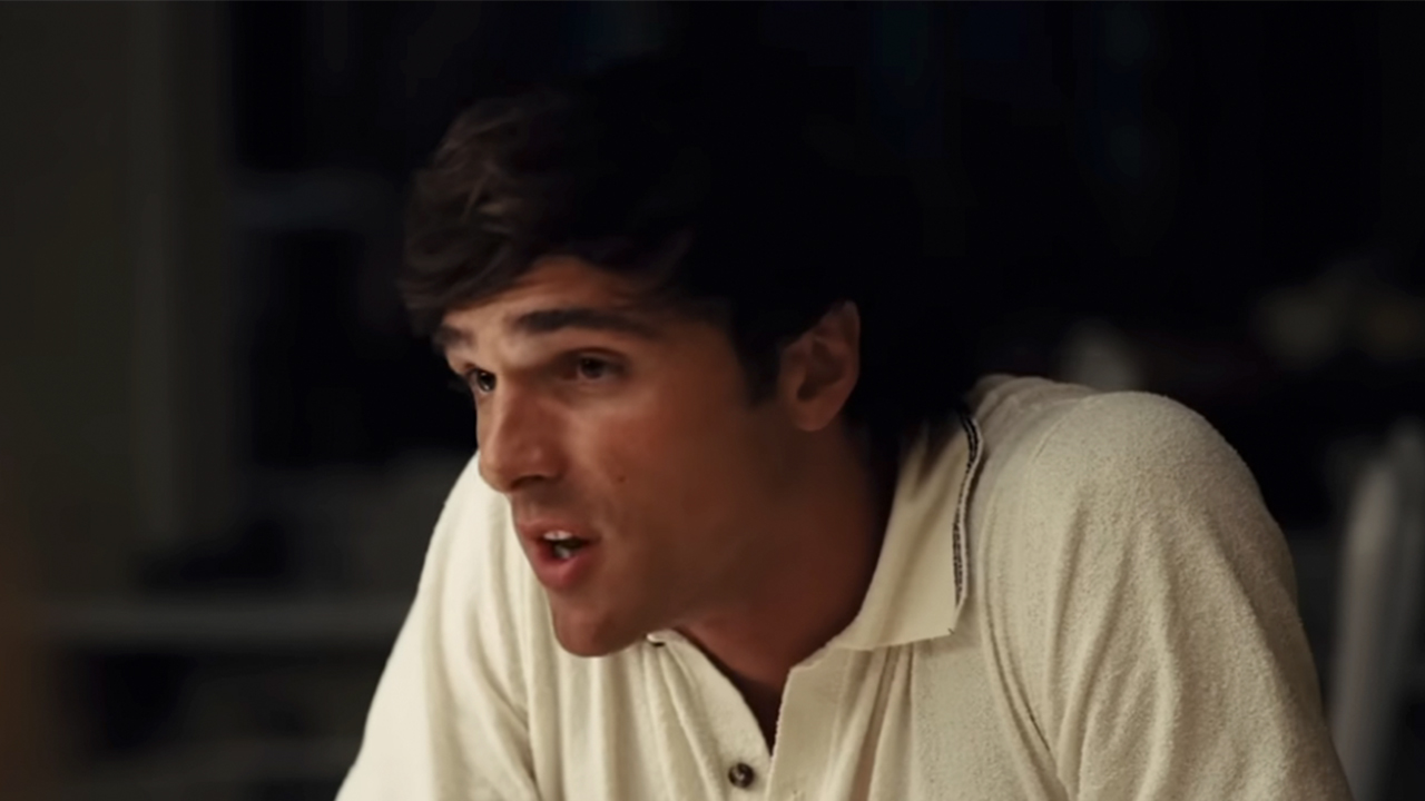 Jacob Elordi in a white collared shirt, looking upset in Euphoria
