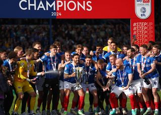 PORTSMOUTH, ENGLAND - APRIL 20: Portsmouth City players celebrate winning the Sky Bet League One competition during a cup presentation following the Sky Bet League One match between Portsmouth and Wigan Athletic at Fratton Park on April 20, 2024 in Portsmouth, England. (Photo by Peter Nicholls/Getty Images)