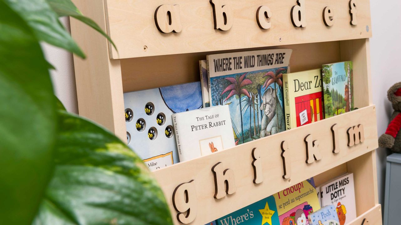 bookshelves with kids books and alphabet design