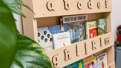 bookshelves with kids books and alphabet design