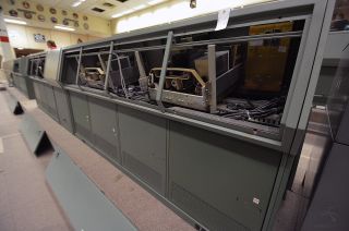 The Cosmosphere's conservators will preserve the original electronics inside NASA's Apollo-era mission control consoles, but will also install modern technology to give the appearance that the consoles are again active, monitoring the first landing on the moon.