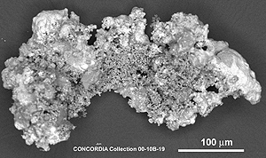 A grayscale image of a micrometeorite with a crystalline structure