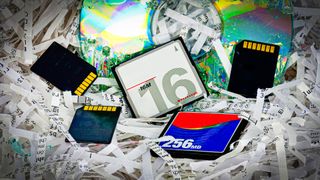Old memory cards on a pile of shredded paper