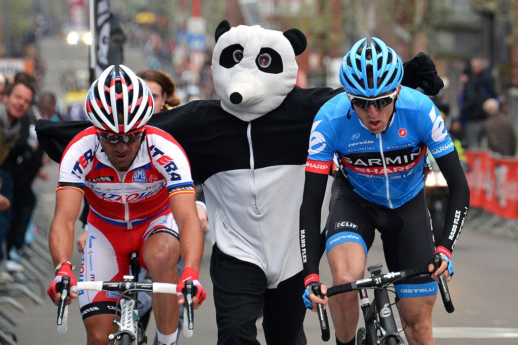 A man dressed as a panda runs near Spains Joaquim Rodriguez Olivier of the Katusha team L and Irelands Daniel Martin of the GarminSharp team R who sprint to win the 99th edition of the LiegeBastogneLiege a 2615 km one day cycling race on April 21 2013 in Liege Martin won the race ahead of the secondplaced Rodriquez and the thirdplaced Valverde AFP PHOTO LIONEL BONAVENTURE Photo credit should read LIONEL BONAVENTUREAFP via Getty Images