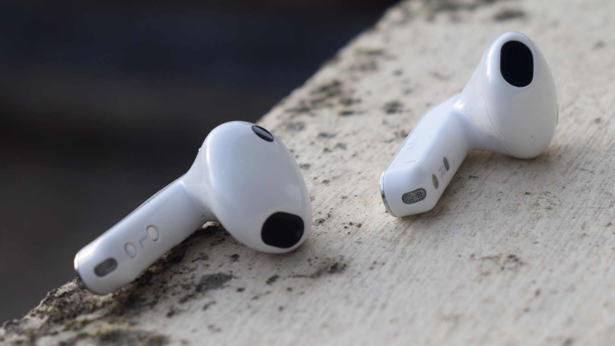 The Samsung Galaxy Buds 4 earbuds on a ledge.