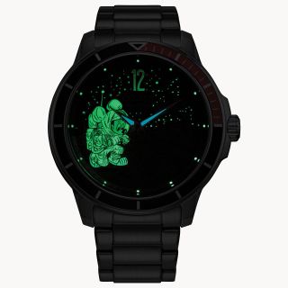 Photo of the new Mickey Mouse moon-explorer watch, showing a spacesuited Mickey glowing green in the dark.