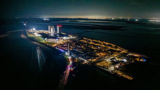 SpaceX moves its Super Heavy booster to the launch pad in Starbase, Texas, ahead of the planned launch of Starship Flight 10. SpaceX posted this photo on X on Aug. 21, 2025.
