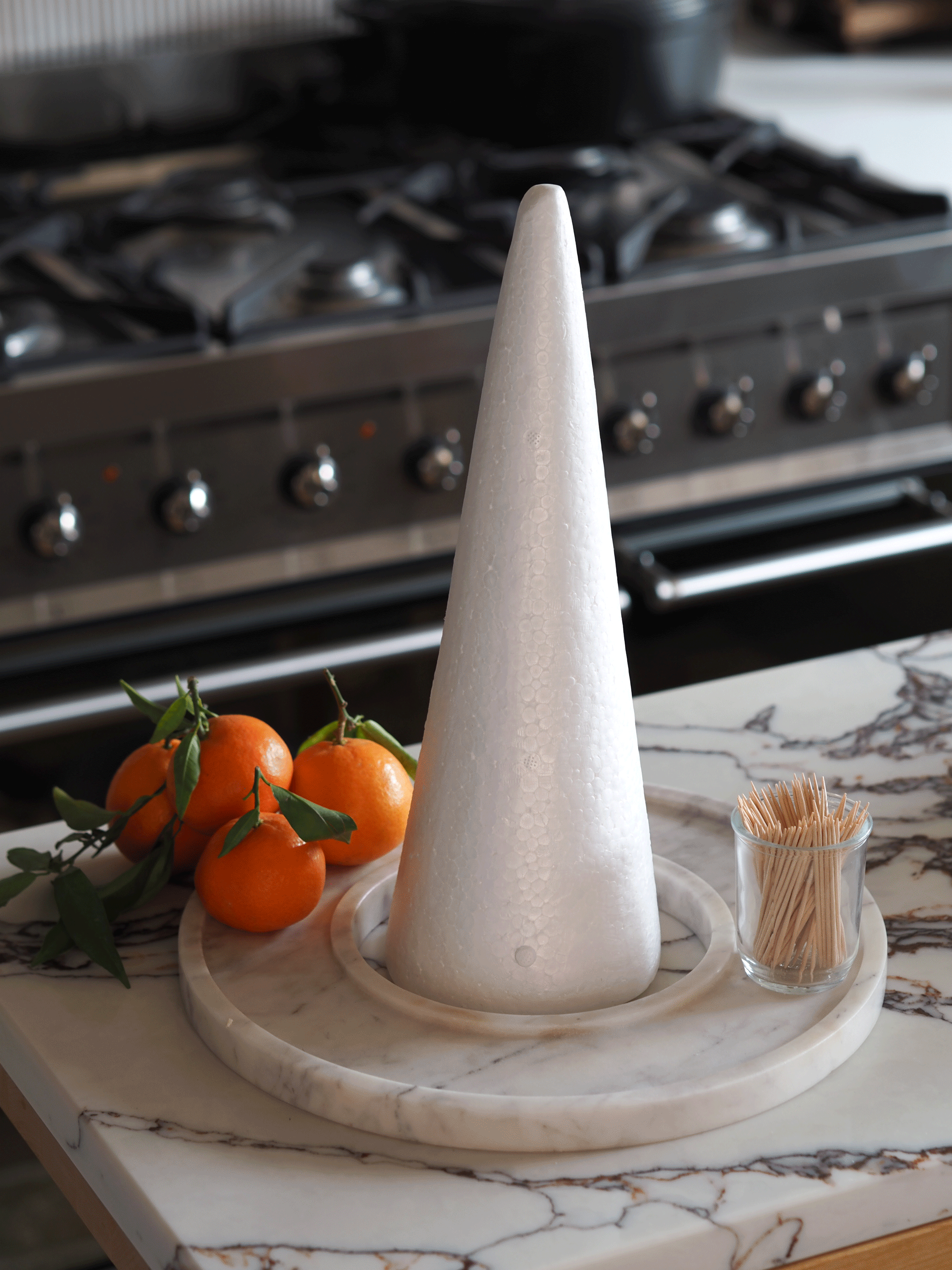 a gif of constructing a orange tree centerpiece