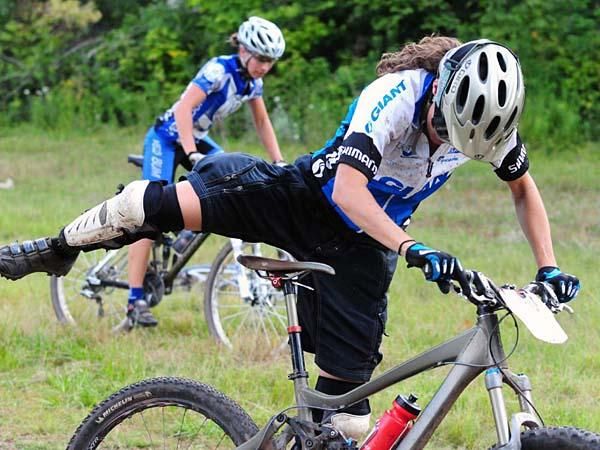 A Giant rider mounts her bike.