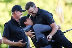 Corey Conners and Tom Kim celebrate the International team's comeback on Day 2