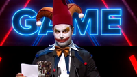 Ben Starr in clown makeup receiving a BAFTA