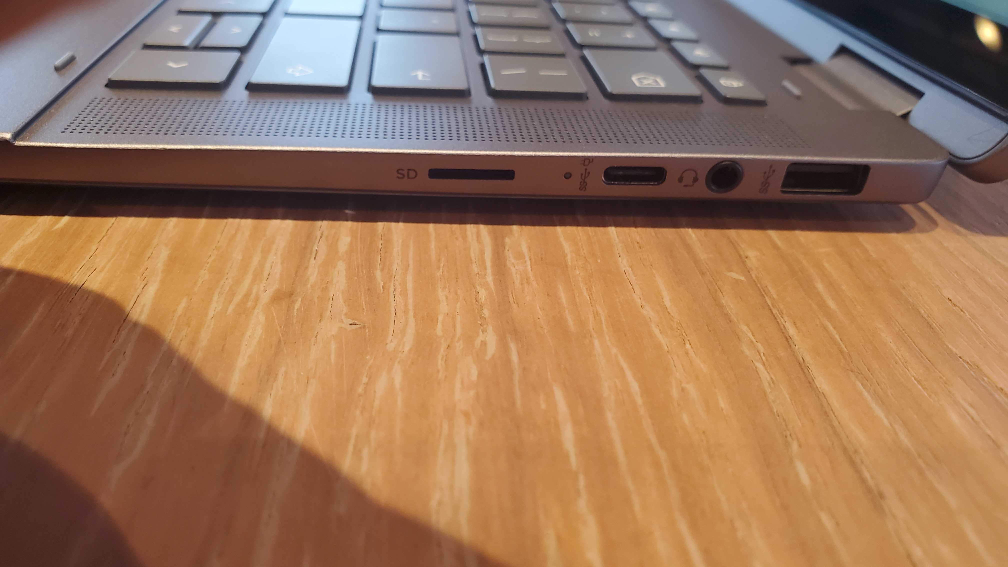 Chromebook Plus laptop on wooden table