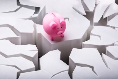pink piggy bank looking over crevice in cracked ground for catch-up contributions story