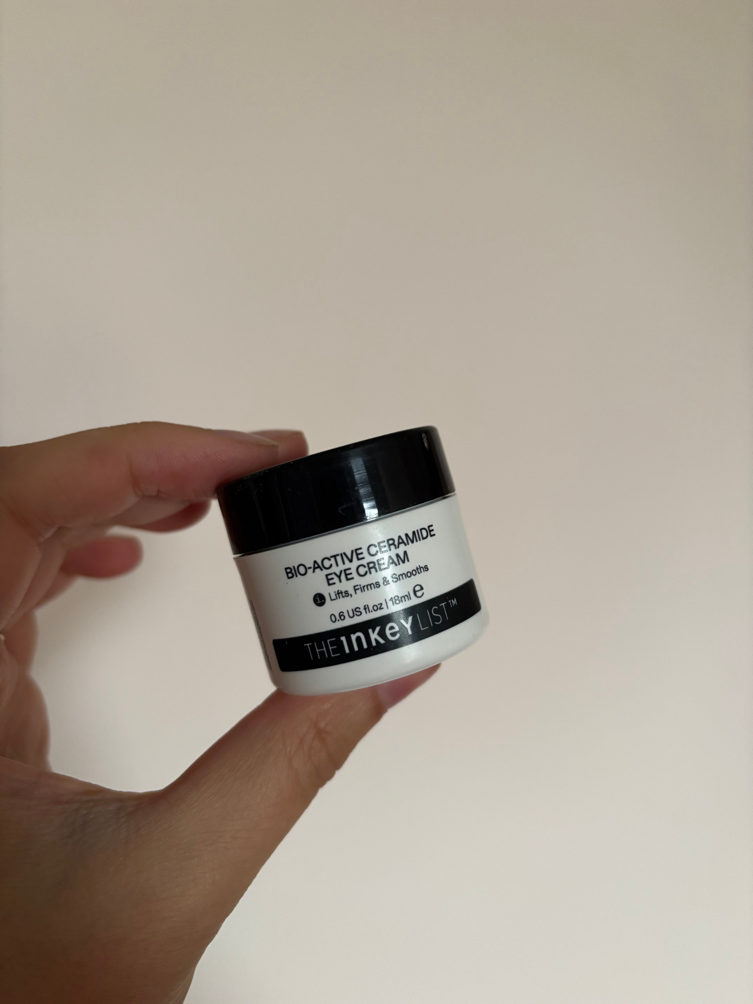 Freelance beauty editor Mica Ricketts holding The Inkey List eye cream