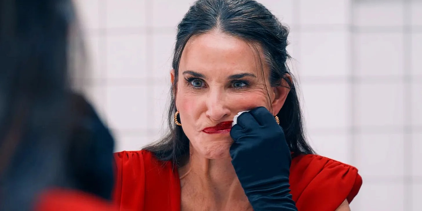 Demi Moore smears her lipstick in a mirror in &#039;The Substance&#039;