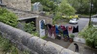 Clothes hanging up on a washing line outside a home