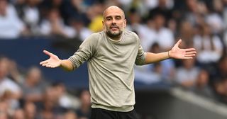Manchester City manager Pep Guardiola gestures during the Premier League match between Tottenham Hotspur and Manchester City at Tottenham Hotspur Stadium on August 15, 2021 in London, England.