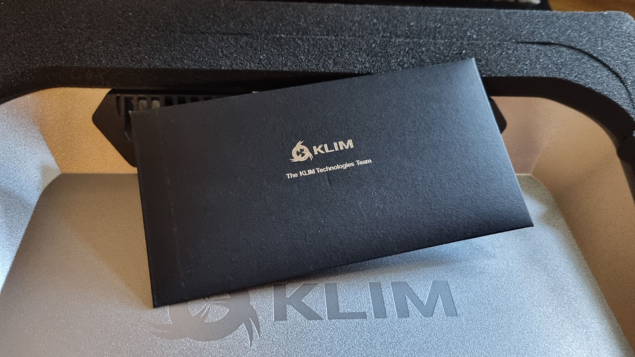 Assorted images of the Klim Everest laptop cooler, and everything included inside the box