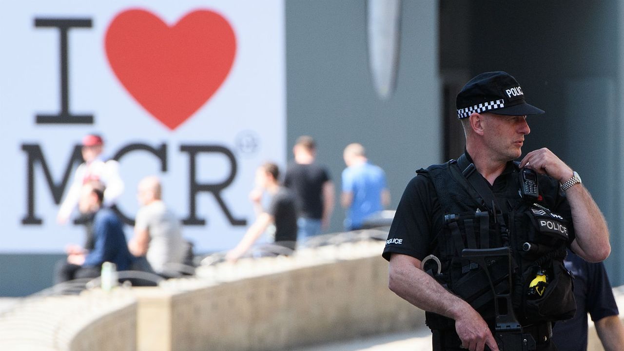 Armed police patrol the city centre ahead of a national minute&amp;#039;s silence for victims of the Manchester arena attack