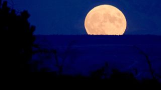 The full Hunter's Moon rises over Crimea, on Oct. 20, 2021/