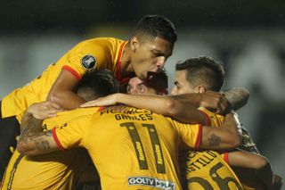 Barcelona Sporting Club players celebrate a goal against Santos in thee Copa Libertadores in 2021.
