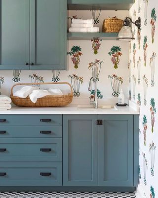 blue laundry room with floral wallpaper and patterned floor by Kristin Challacombe