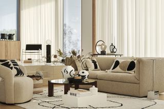 Beige living room with curved textured sofa and black and white cushions