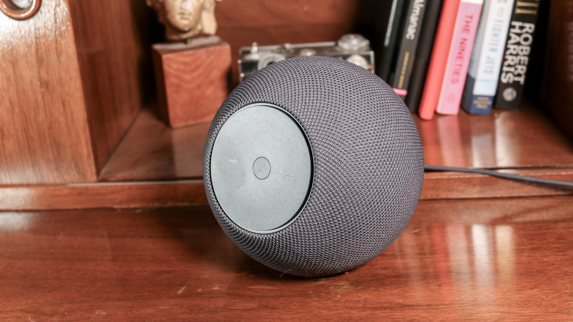 Amazon Echo Studio on a book shelf