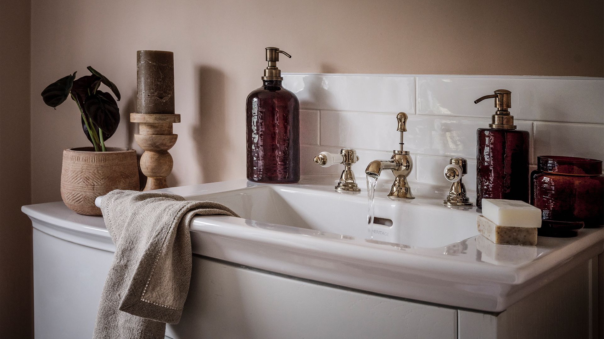 bathroom sink with stylish toiletries