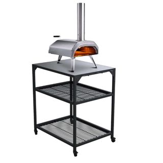 Ooni metal pizza oven table with two mesh shelves and wheeled castors 