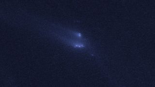 This photo from the Hubble Space Telescope shows the rare sight of the asteroid P/2013 R3 breaking apart. This image, the third in a series, was taken on Dec. 13, 2013. Image released March 6, 2014.