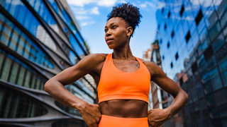 Woman about to go on a run through city