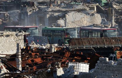 Buses await safe passage from Aleppo, Syria