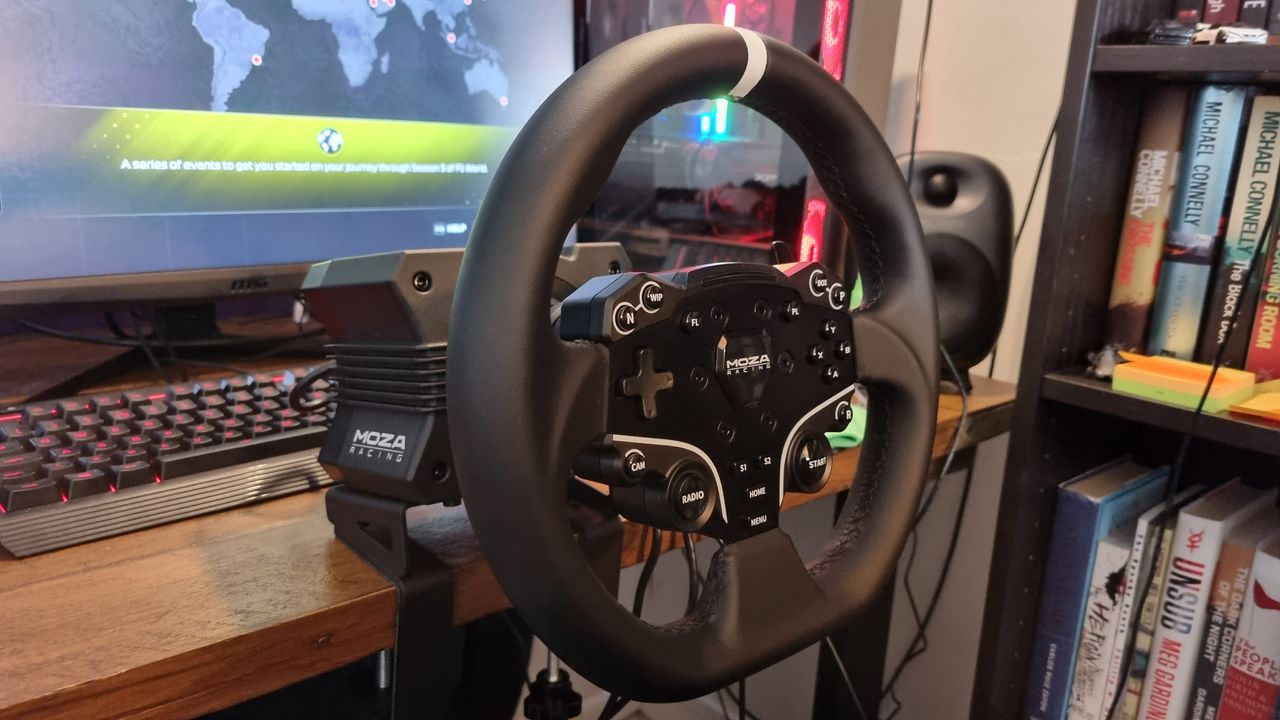 A side angle of the MOZA R5 wheelbase mounted to a desk