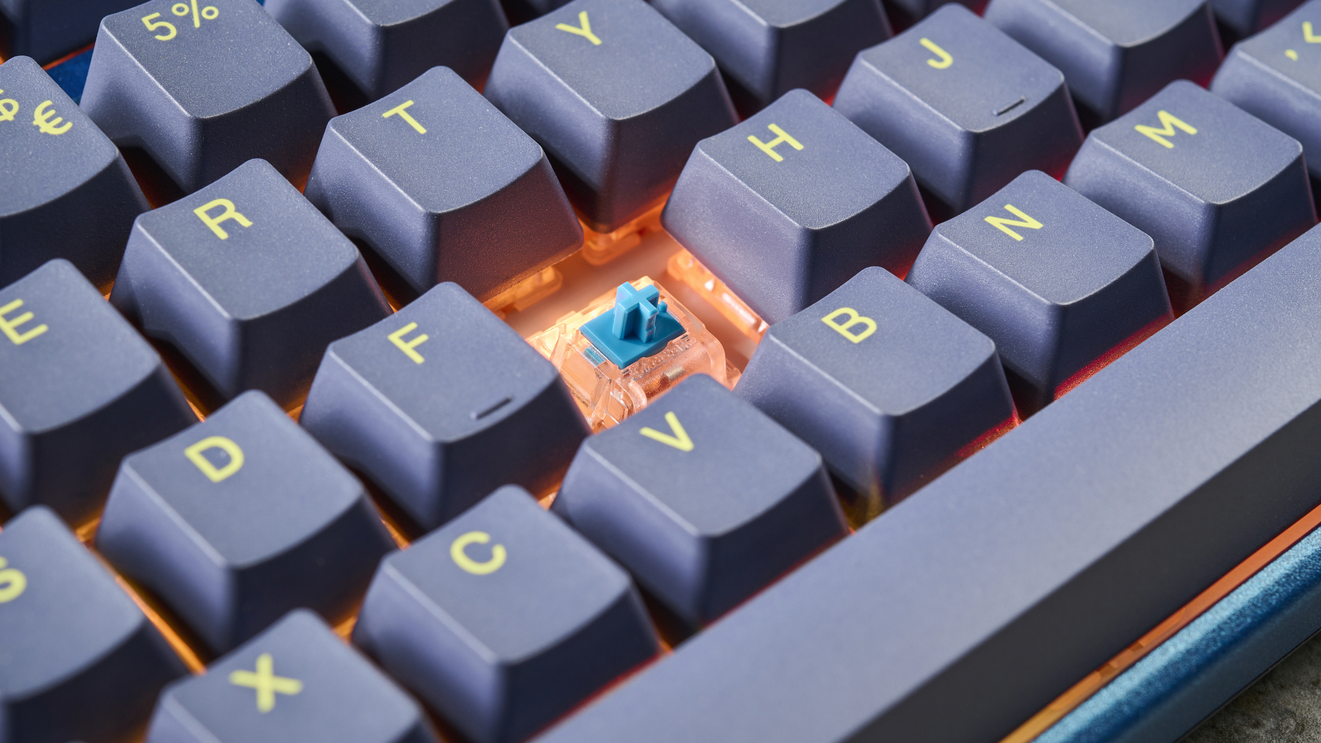 A visible switch of a Ducky One 3 TKL wireless keyboard in the DayBreak colorway